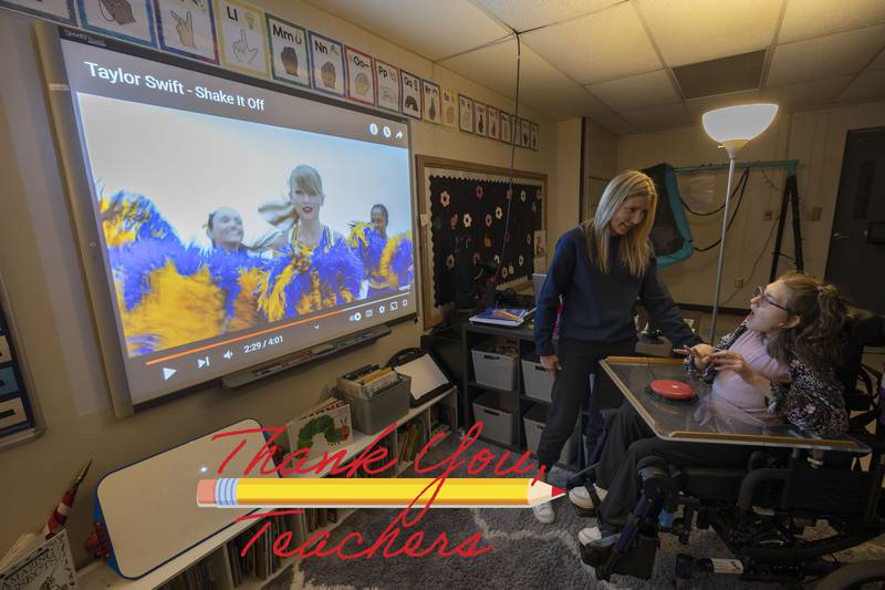 Amy Boss, speech and language pathologist at Reagan Middle School, works with student Addy Weidman Thursday, April 6, 2023. Weidman uses a variety of technology in her learning.