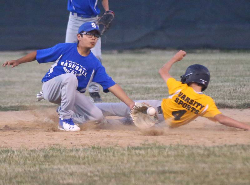 Screaming Eagles shortstop Sebastian Flores brings in the throw and puts a tag on Varsity Sports baserunner Cutler Dutko (4) during the Streator Major championship game on Wednesday, June 29, 2022, at Southside Diamond in Streator.