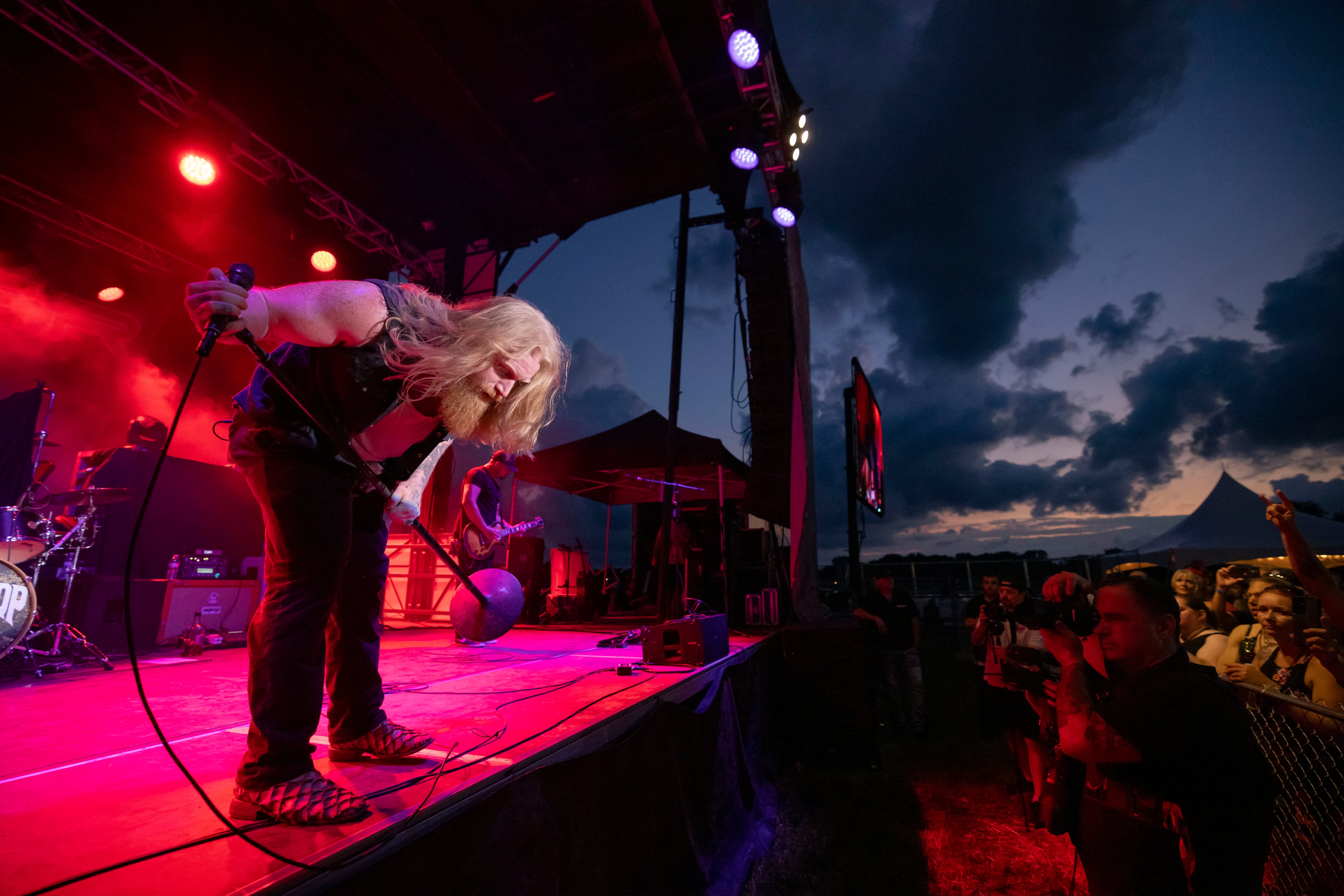 Blacktop Mojo vocalist Matt James bows to the crowd after the first song of their set at Streatorfest on August 1, 2024.