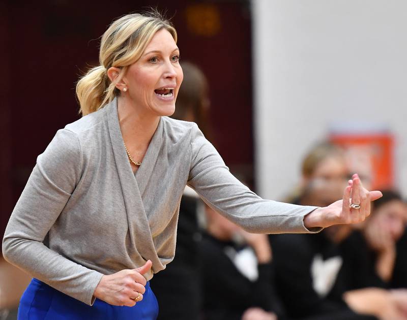 Montini head girls basketball coach Shannon Spanos directs the Broncos during the final seconds of the Montini Christmas Tournament championship game against St. Charles East on Dec. 29, 2023 at Montini Catholic High School in Lombard.