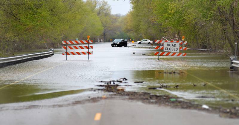 A section of U.S. Route 84 between Fulton and Albany remained closed Sunday as the Mississippi River continued to flood.