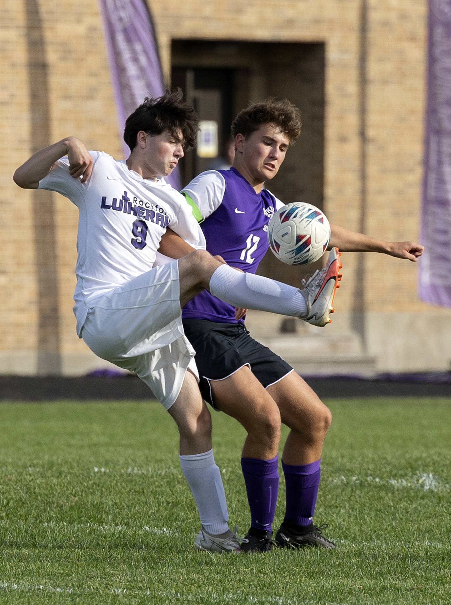 Dixon’s Quinn Flanagan and Rockford Lutheran’s Joshua Ament fight for the ball Wednesday, Sept. 18, 2024.