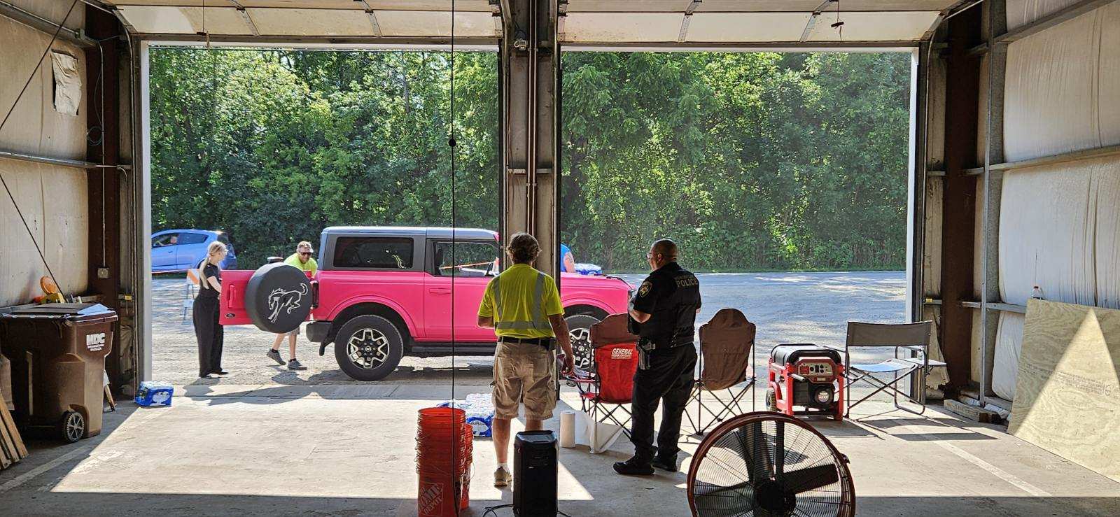 Wonder Lake Public Works employees load water into resident vehicles on Friday, July 26, 20224. The village has been handing out bottled water to residents living under a boil order since Monday, July 22, 2024. The village is also working to get water to those who are home-bound.