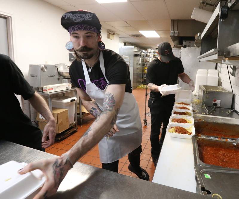 Cooks Zak Byrnes and Steve Jensen prepare spaghetti during the 24th annual Lighted Way Spaghetti dinner on Monday, March 27, 2023 at Uptown in La Salle.