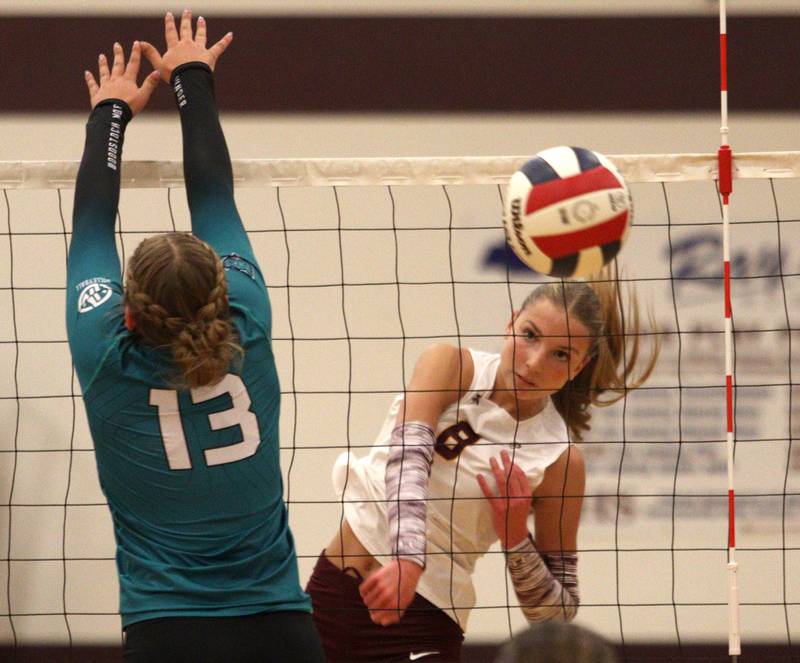 Richmond-Burton’s Daniella Hopp sends the ball over the net against Woodstock North in varsity volleyball on Monday, Sept. 16, 2024, at Richmond-Burton High School in Richmond.