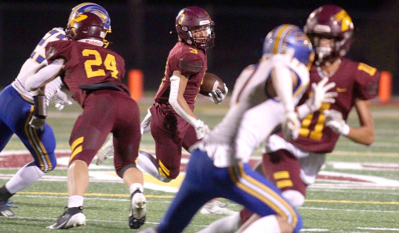 Richmond-Burton’s Oscar Bonilla Jr. runs the ball against Johnsburg in varsity football action on Friday, Sept. 13, 2024, at Richmond-Burton High School in Richmond.