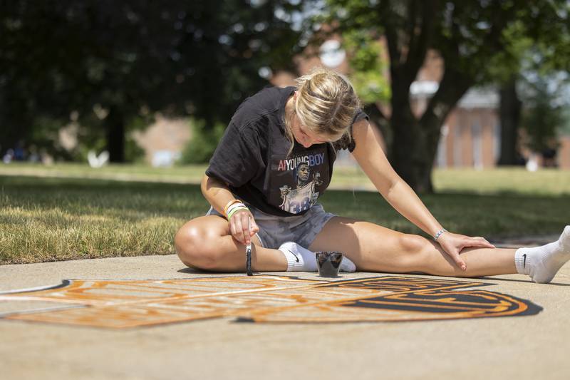 Layni Lappin, 17, works on her painting Monday, July 3, 2023 during Petunia Fest’s Brush and Bloom.