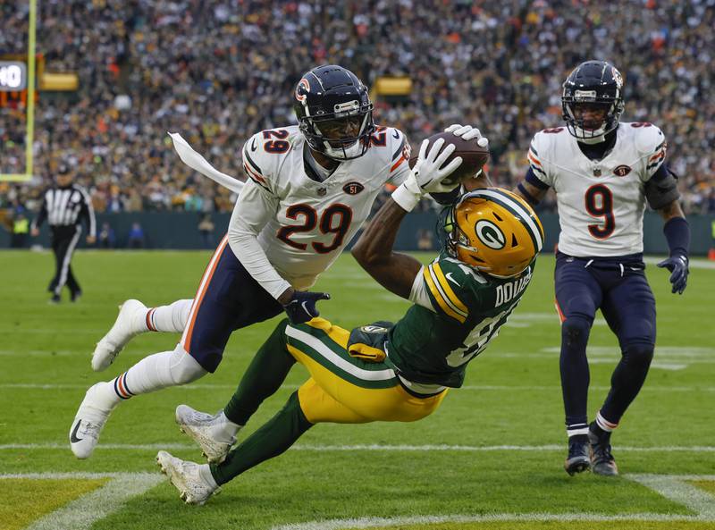 Green Bay Packers wide receiver Romeo Doubs can't catch the ball while defended by Chicago Bears cornerback Tyrique Stevenson during the first half Sunday, Jan. 7, 2024, in Green Bay, Wis.