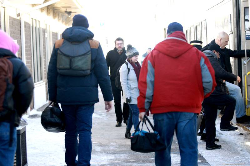 Commuters brave sub-zero temperatures as they board a Metra train in Geneva on Tuesday, Jan. 16, 2024.