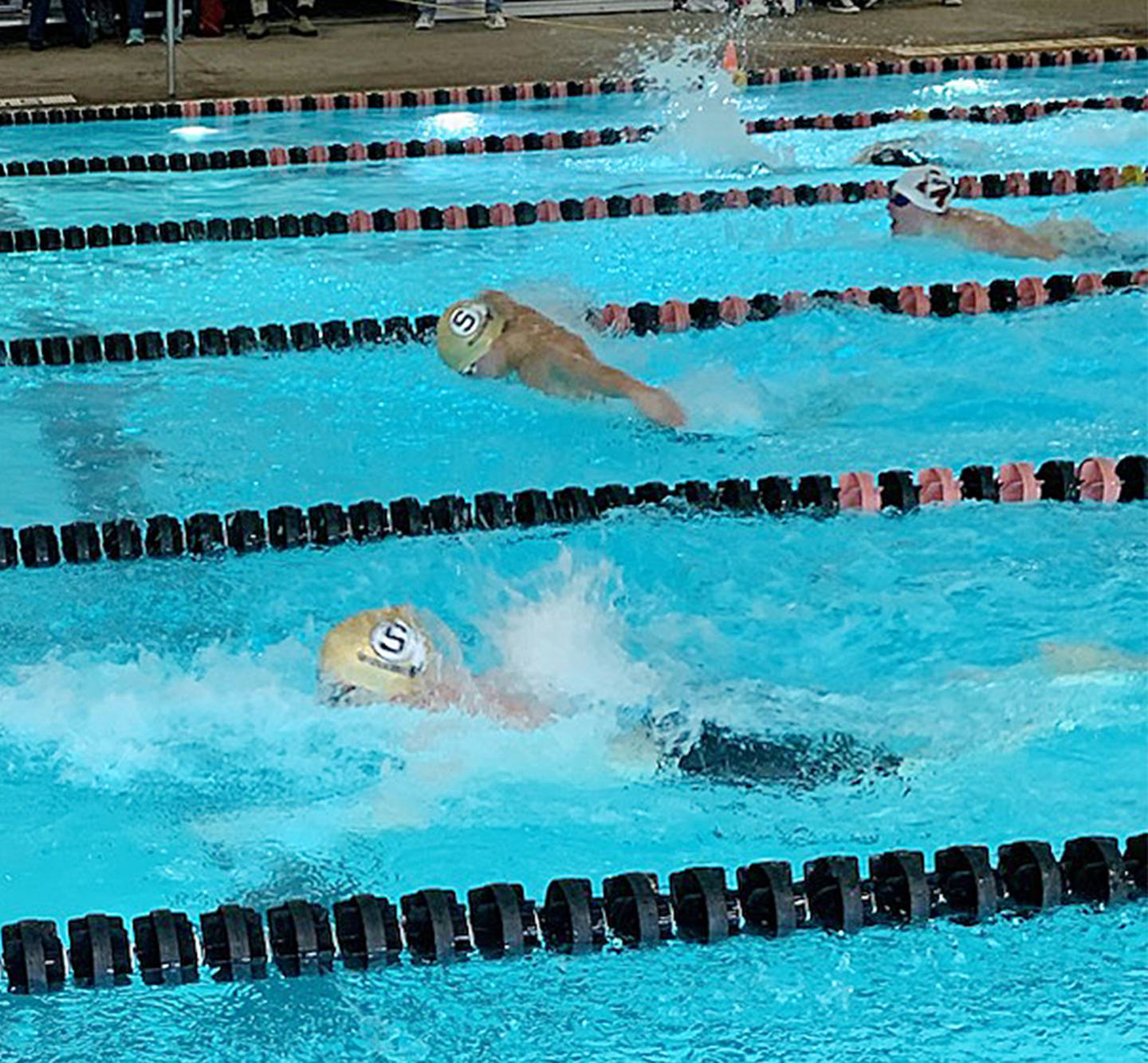 Sterling's Peter Garland (bottom) and Connor Pham swim side-by-side during the 100-yard butterfly at the United Township Sectional on Saturday, Feb. 18, 2023 in East Moline.