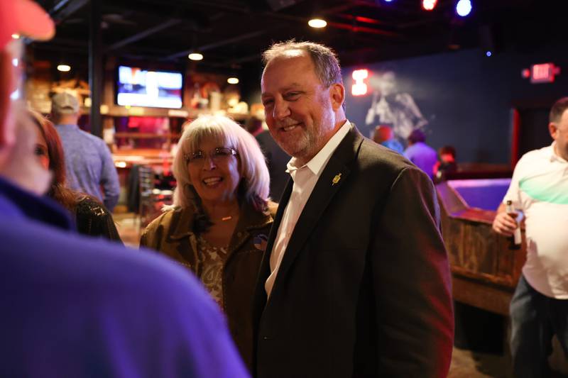 Jim Reilly, Republican candidate for Will County Sheriff (right) stands with Dawn Damiani at a Shorewood bar. Unofficial results showed Reilly had a 289 vote lead over Democrat Will County Sheriff Mike Kelley as of 10 p.m. on Tuesday, Nov. 8, 2022.