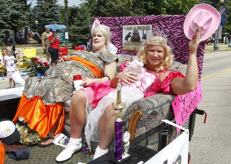 Drs. Brent Gandolfi and Jeff Swafford from My Eye Xpert dress as Mama June and Honey Boo Boo as they wave to the crowd during the Gurnee Days Parade on Old Grand Avenue.