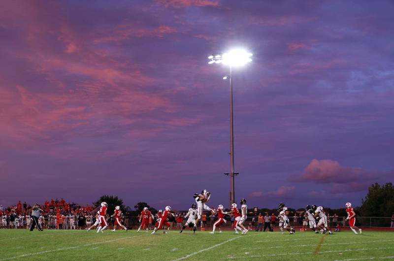 A pair of Barrington players reel in a short South Elgin punt Friday, Aug. 30, 2024 in South Elgin.