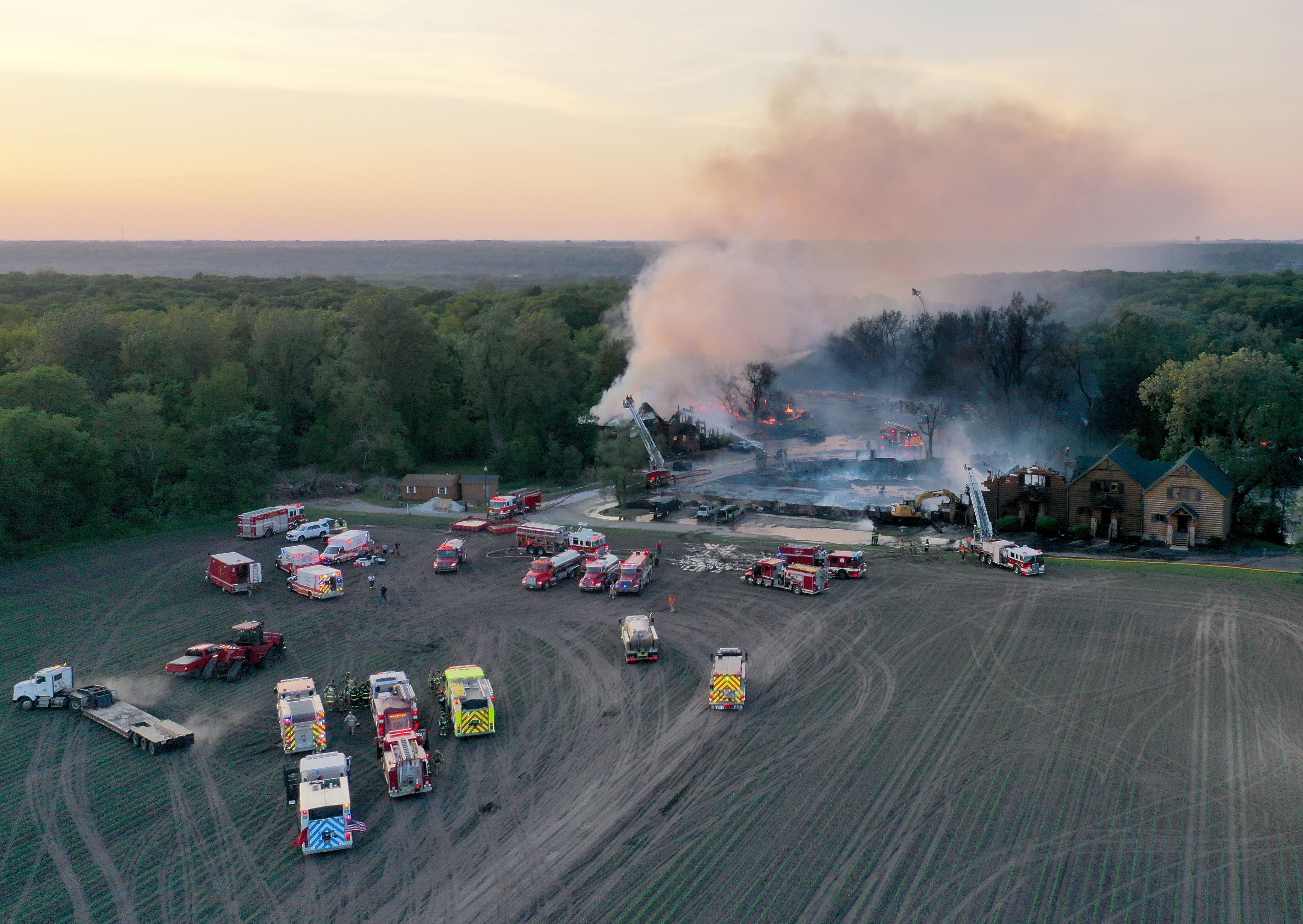 Firefighters fight a five-alarm fire that burned cabins at the Grand Bear Resort on Monday, May 30, 2022, in Utica. 