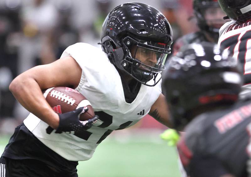 Northern Illinois University running back Gavin Williams carries the ball Tuesday, March 26, 2024, during spring practice in the Chessick Practice Center at NIU.