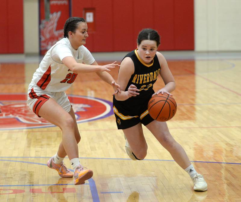 Riverdale's Jillian Murray (23) drives past Stillman Valley's Payge Barger (20) during a Tuesday. Feb. 20, 2024 game at the 2A Oregon Sectional held at the Blackhawk Center at Oregon High School. The Rams's season ended with a 57-34 loss to the Cardinals.