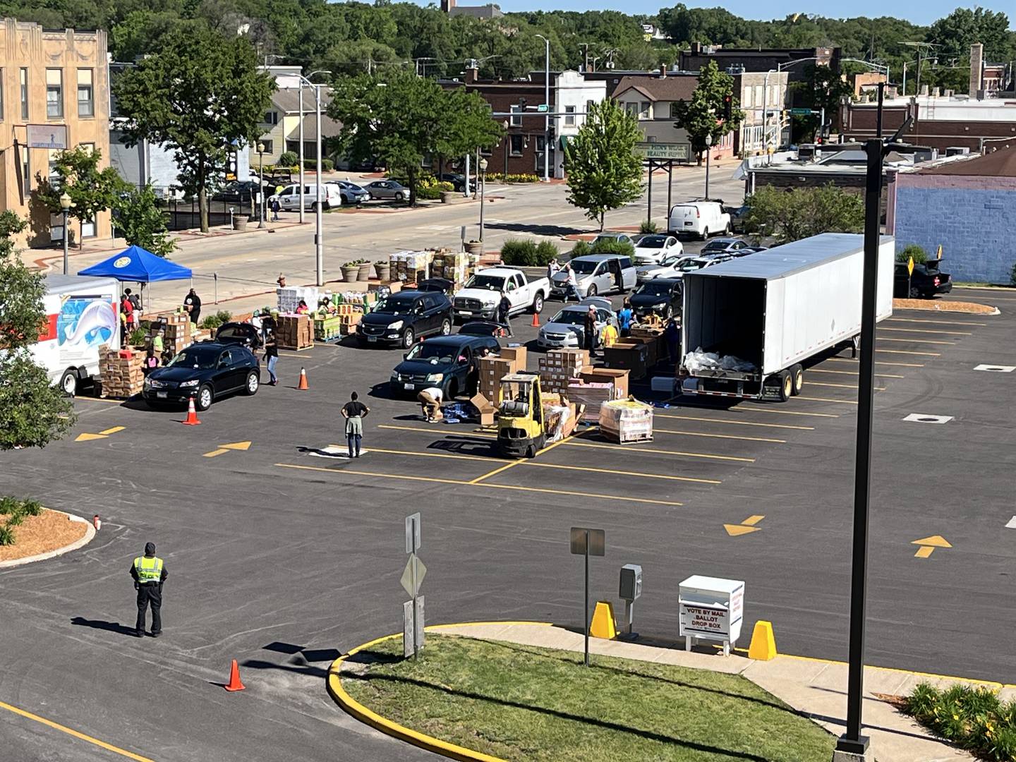 Families travel to a free food giveaway event on Saturday, May 25, outside the Will County office building, 302 N. Chicago St., Joliet. The event was hosted by Will County Executive Jennifer Bertino-Tarrant and nonprofit organization ShareFest Will County.