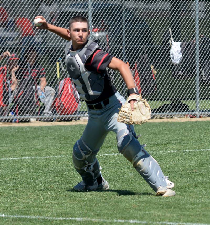 Forreston catcher Mikey Probst fields a bunt and gets ready to throw to first during the 1A sectional championship game with East Dubuque on Saturday, May 25, 2024 at Forreston High School. East Dubuque scored two runs in the top of the seventh inning to edge the Cardinals 4-3 and move on to the supersectional.