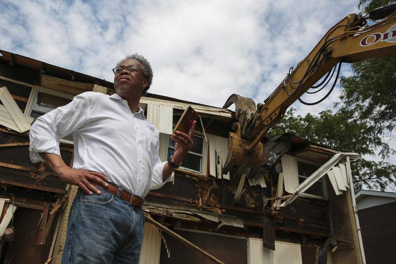 Housing Authority of Joliet CEO Michael Simelton oversees demolition on Saturday, June 8, 2019, at Fairview Homes in Joliet, Ill.