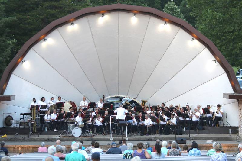 The DeKalb Municipal Band plays as the sun sets Tuesday, June 21, 2022, during their concert at Hopkins Park in DeKalb. The band presents concerts at 7:30 p.m. during the summer every Tuesday through August 23, with the exception of July 5.