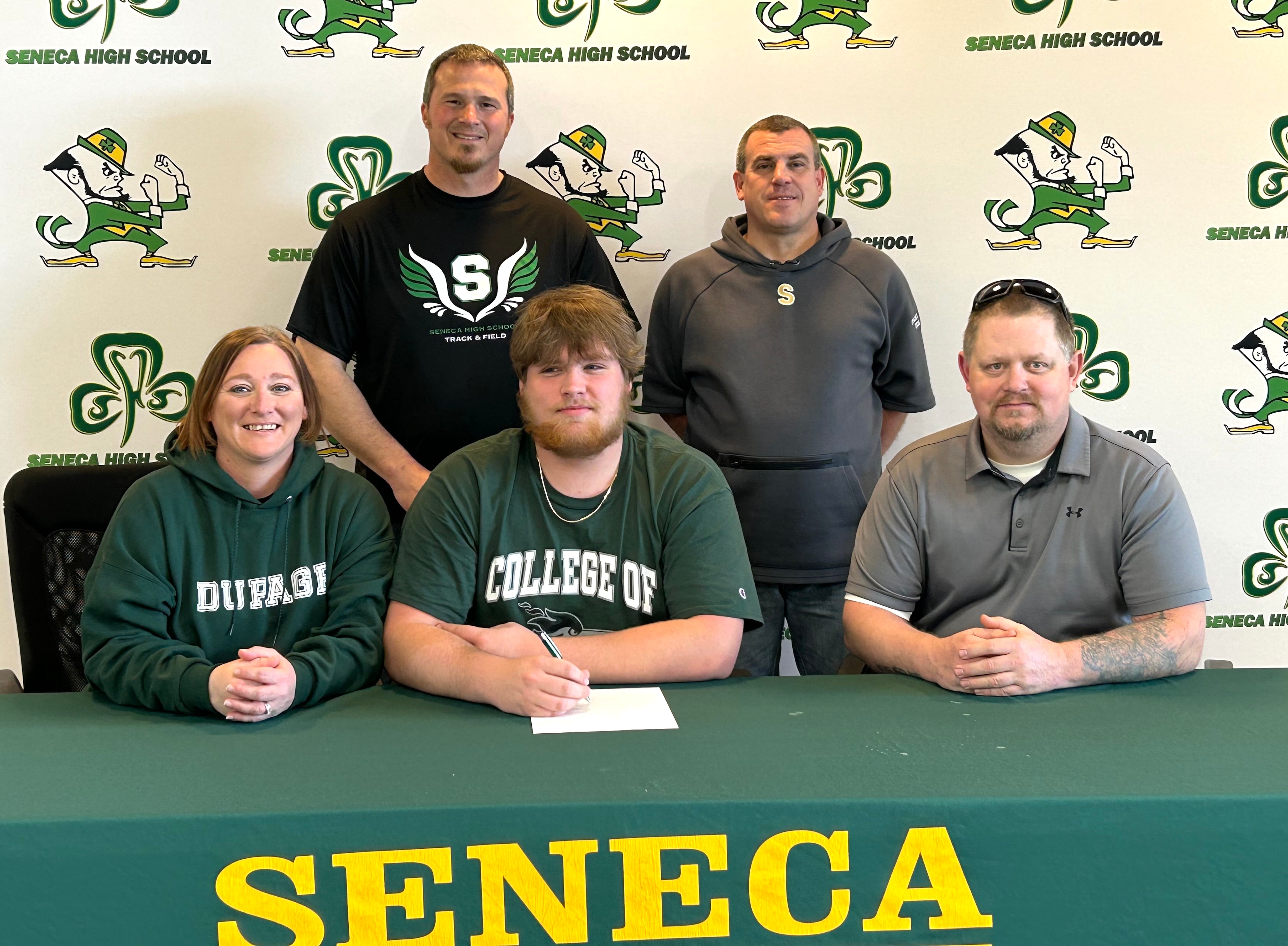 Seneca graduate Josh Lucas has signed to continue his education at the College of DuPage in Glen Ellyn and his football career at the NJCAA level with the Chaparrals. Lucas was a two-way lineman and first-team selection to the 2023 Times All-Area Football Team during his Fighting Irish career. Pictured at his signing ceremony are (front, from left) Millissa Downey, Josh Lucas, Tom Downey along with (back, from left) Terry Maxwell and Ted O’Boyle.