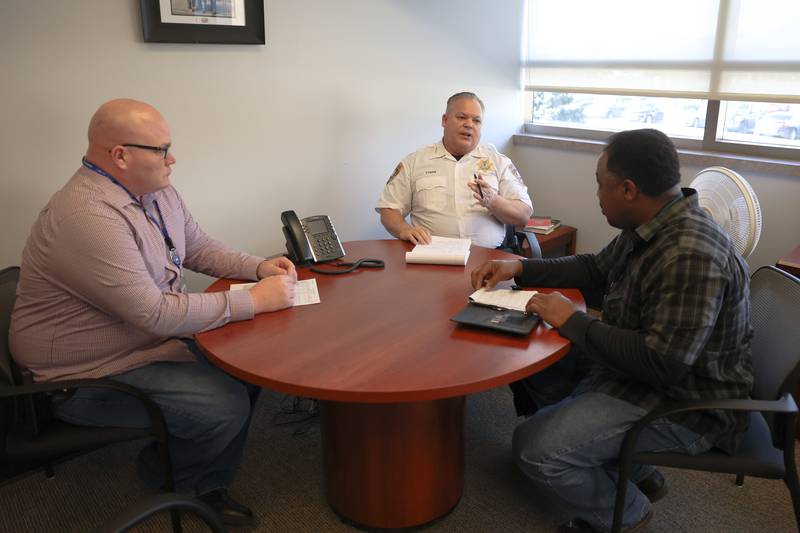 Joliet Police Public Affairs Sergeant Dwayne English, Chief William Evans and Deputy Chief Carlos Matlock meet at Chief Evans’ office Friday, February 17th in Joliet.