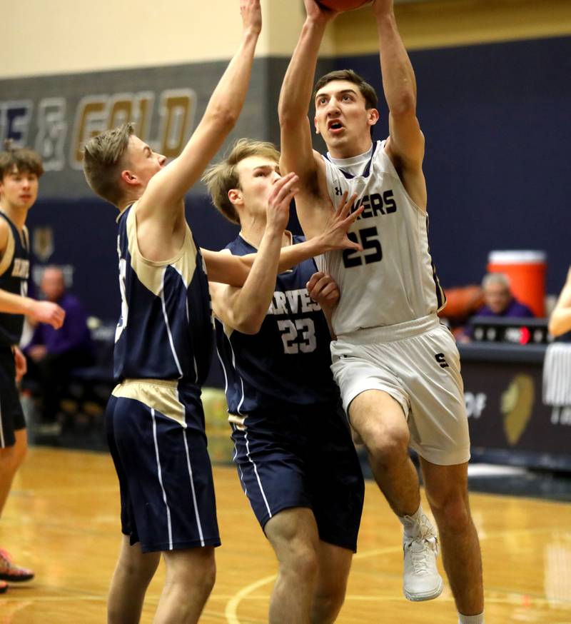 Harvest Christian Academy’s JJ Gonnam (left) tries to get around Serena’s Carson Baker during the Class 1A Harvest Christian Academy Sectional semifinal game on Wednesday, Feb. 28, 2024 in Elgin.