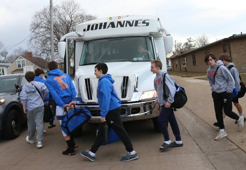 Members of the Oglesby Washington 7th grade basketball team board a charter bus to attend the Illinois Elementary School Association Class 2A State championship on Thursday, Feb. 8, 2024 at Oglesby Washington School. Oglesby plays Effingham for the Class 2A State Title.