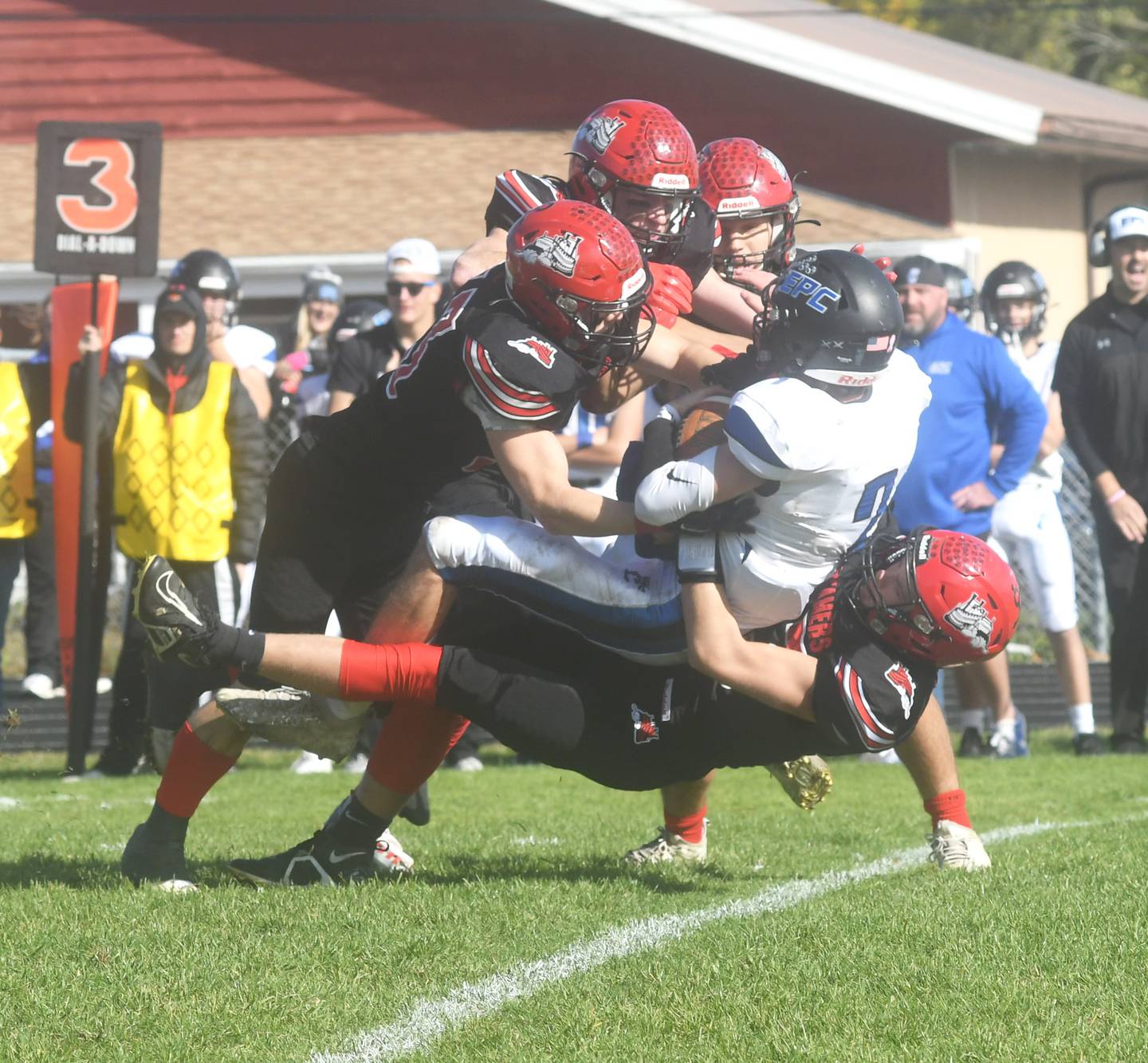 Four Fulton defenders swarm EPC's Carson Heeren during Saturday, Oct. 15 action in Fulton.