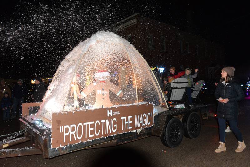 Hanford Insurance provided snow with their entry in Erie's Hometown Holidays Lighted Parade on Saturday, Dec. 2, 2023.