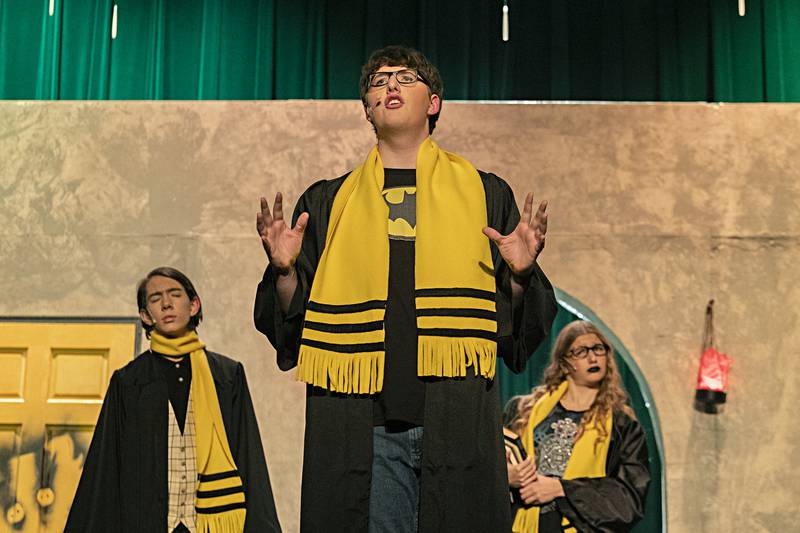 Gavin Frey, playing the part of Wayne, acts out a scene in “Puffs” during rehearsal Wednesday, Nov. 1, 2023 at Dixon High School.