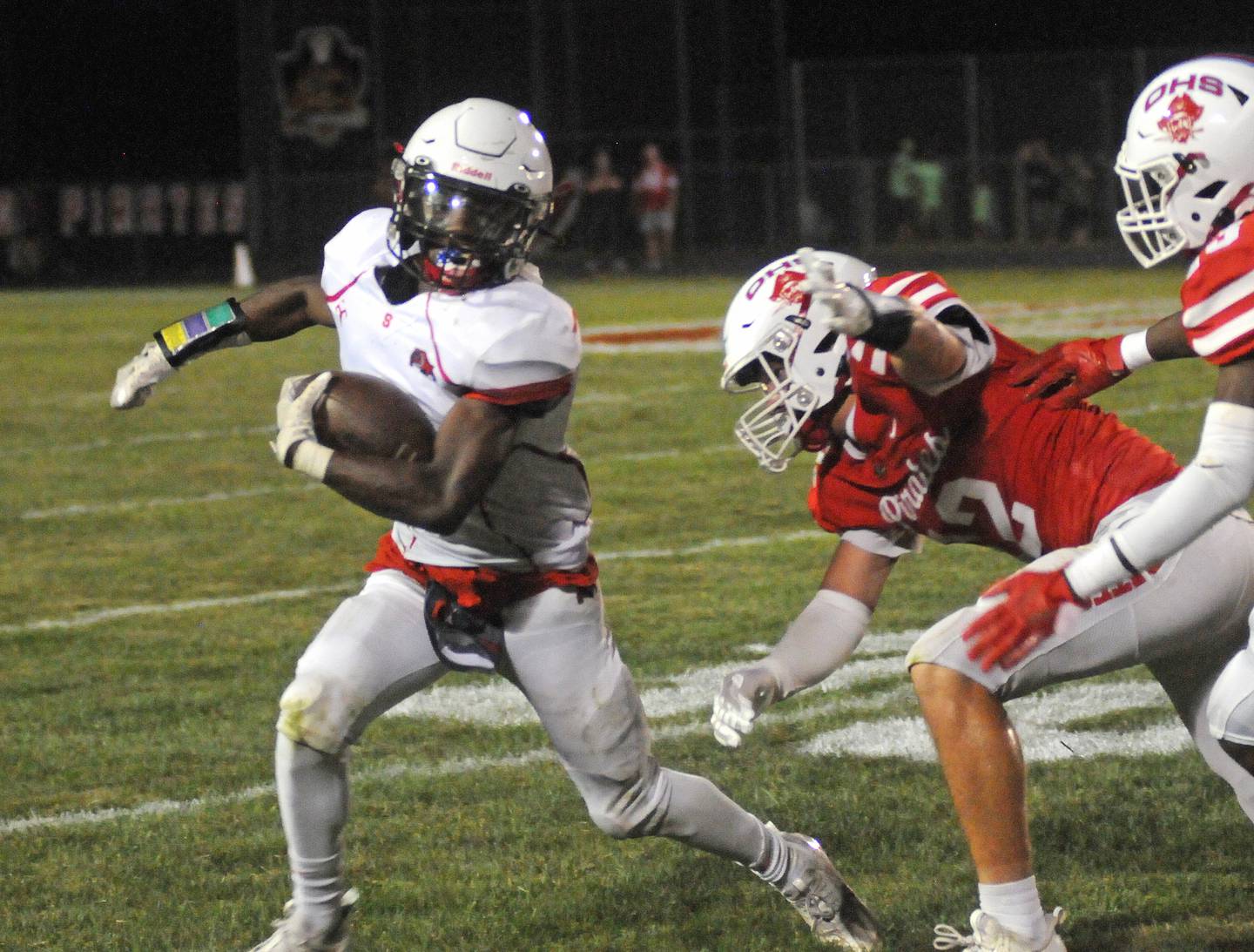 Streator's Isaiah Brown (1) tries to avoid the tackle of Ottawa's Luke Boaz (12) and Keevon Peterson (23) at King Field last season.