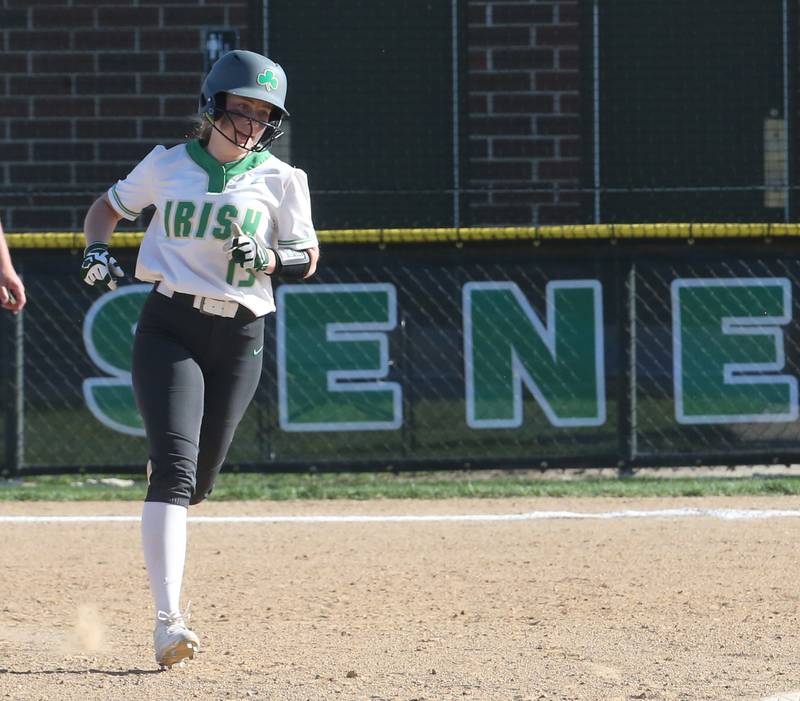 Seneca's Kennedy Hartwig smiles as she runs around the bases after hitting a home run against Putnam County on Thursday, April 13, 2023 at Seneca High School.