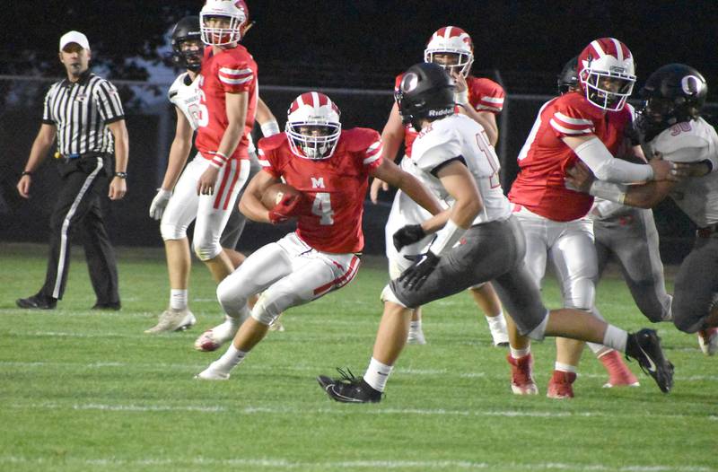 Morrison’s Brady Anderson (4) runs around the Orion defense during a game on Friday, Sept. 8 at the Bud Cole Field at Morrison High School.