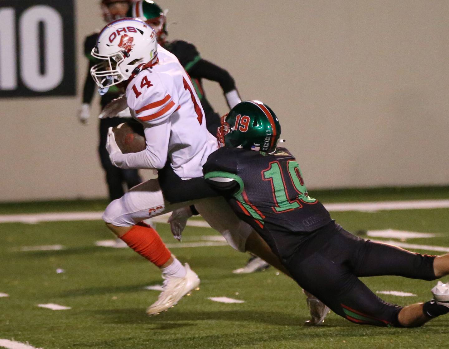 Ottawa's Archer Cechowicz runs the ball as he is brought down from behind by L-P's Will Mertes on Friday, Oct. 6, 2023 at Howard Fellows Stadium.