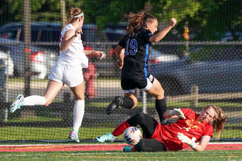 Batavia’s Reagan Sulaver (25) dives to make a save against St. Charles North's Laney Stark (19) during a Class 3A Batavia Regional final soccer match at Batavia High School in Batavia on Friday, May 17, 2024.