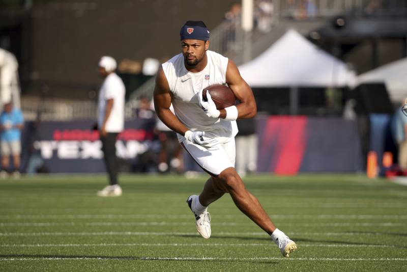 Chicago Bears wide receiver Rome Odunze (15) warms up prior to the start of an NFL preseason football game against the Houston Texans, Thursday Aug. 21, 2024, in Canton, Ohio.