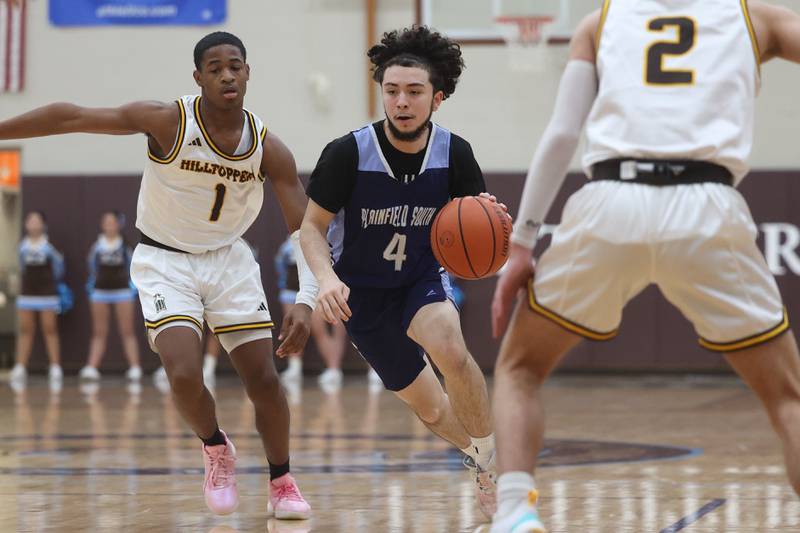 Plainfield South’s Jay Pena makes a move to the basket against Joliet Catholic on Wednesday, Jan. 17th, 2024 in Joliet.