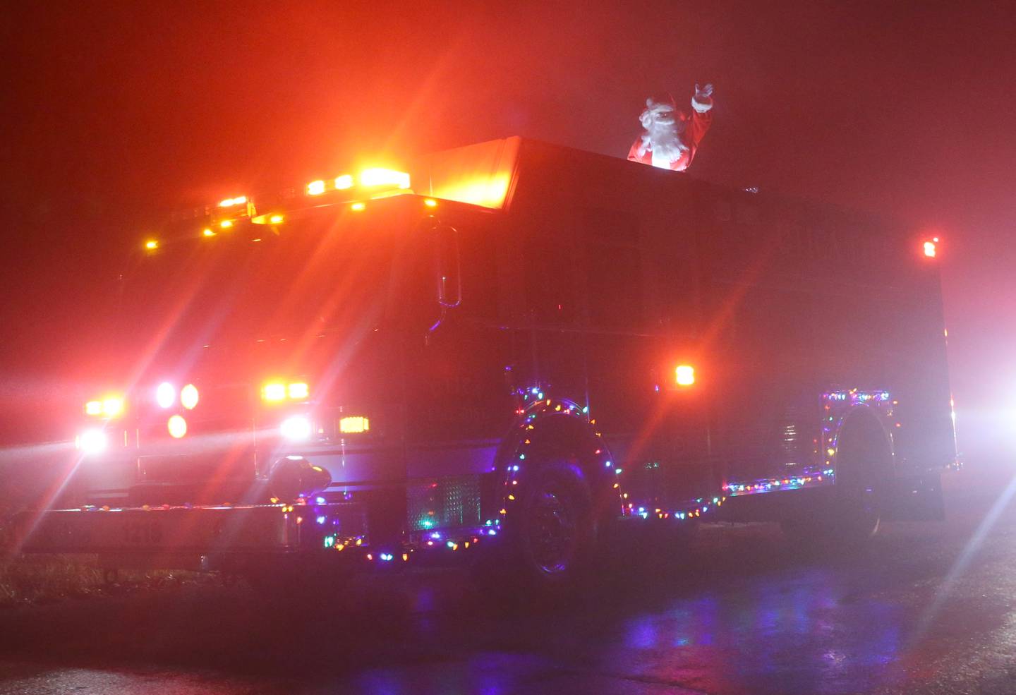 Santa Claus rides in a Utica Fire engine during the Utica Fire Department Santa parade on Saturday, Dec. 23, 2023. Santa took time out of his busy schedule to parade through most of the the Village of Utica bringing cheer to children of all ages. The Utica Fire Protection District has been hosting Santa since December 1941 and is one of the oldest Santa parades in the Illinois Valley. Each December, the Utica Fire Department escorts Santa throughout subdivisions and parades throughout the village.