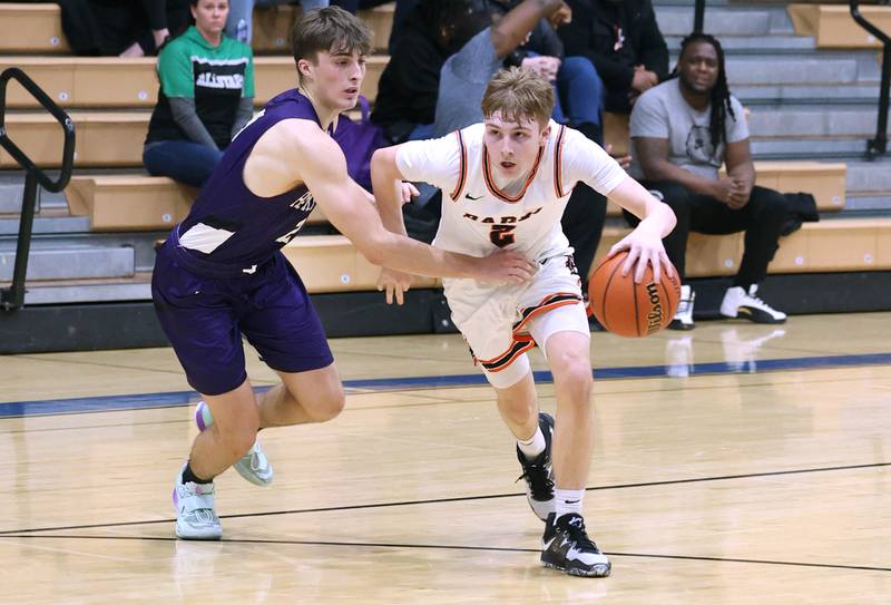 DeKalb's Sean Reynolds goes by Hampshire's Joey Costabile Friday, Feb. 24, 2023, during the Class 4A regional championship game at St. Charles North High School.