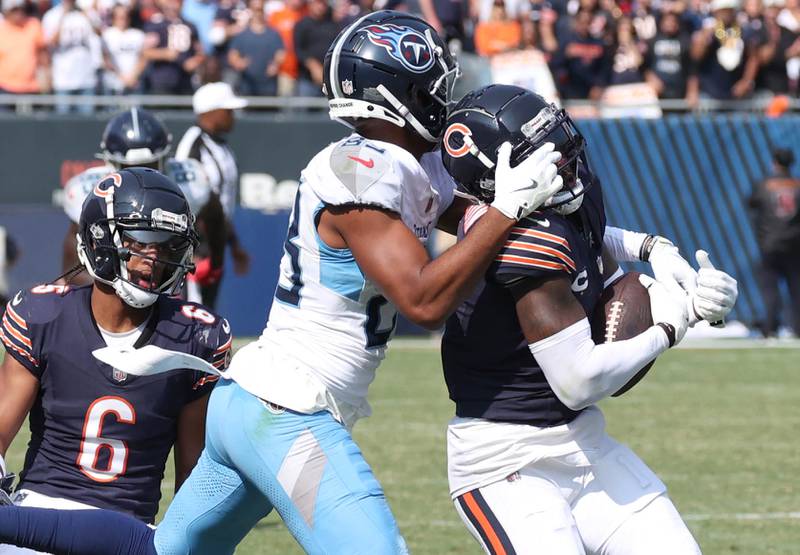 Chicago Bears cornerback Jaylon Johnson intercepts a pass intended for Tennessee Titans wide receiver Tyler Boyd sealing the win for the Bears during their game Sunday, Sept. 8, 2024, at Soldier Field in Chicago.