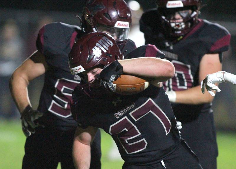 Marengo’s Connor Sacco lunges for the end zone on a touchdown run against Richmond Burton in varsity football at Rod Poppe Field on the campus of Marengo High School in Marengo on Friday, Oct. 18, 2024.