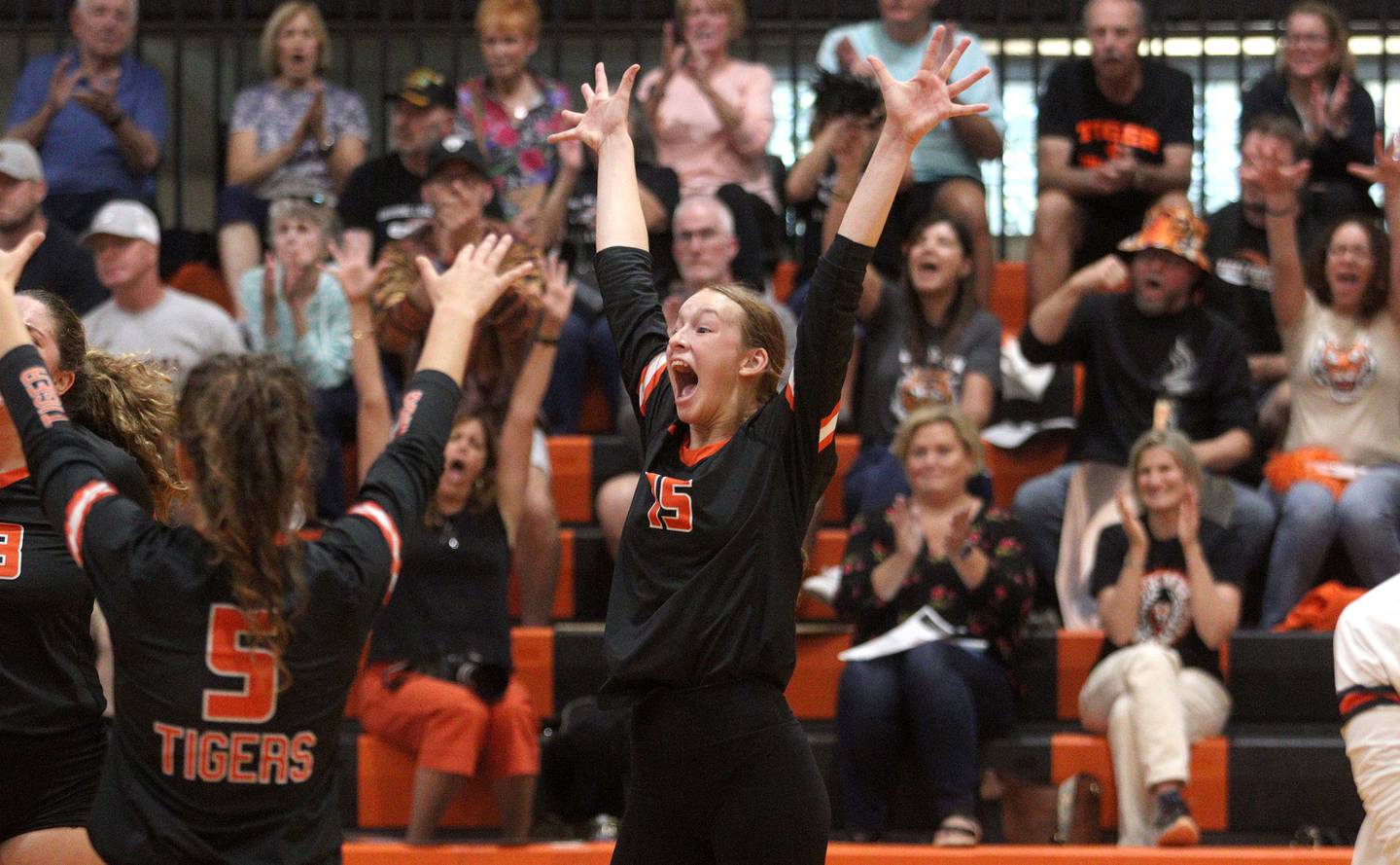 Crystal Lake Central’s Gabbie Anderson and the Tigers get revved up during a rally in their three-set loss to Prairie Ridge in varsity volleyball at Crystal Lake Central Thursday night.