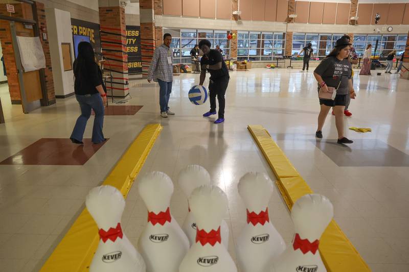Jamare Burnett plays a bowling game at the annual Special Population Dance hosted by Joliet West high school on Friday, March 22, 2024.