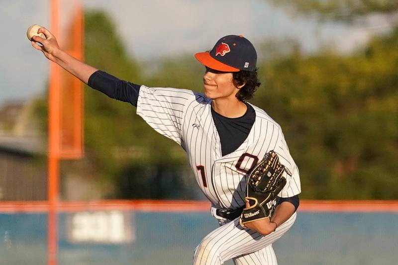 Oswego’s Patrick Jasinski (1) delivers a pitch against Yorkville during a baseball game at Oswego High School on Monday, April 29, 2024.