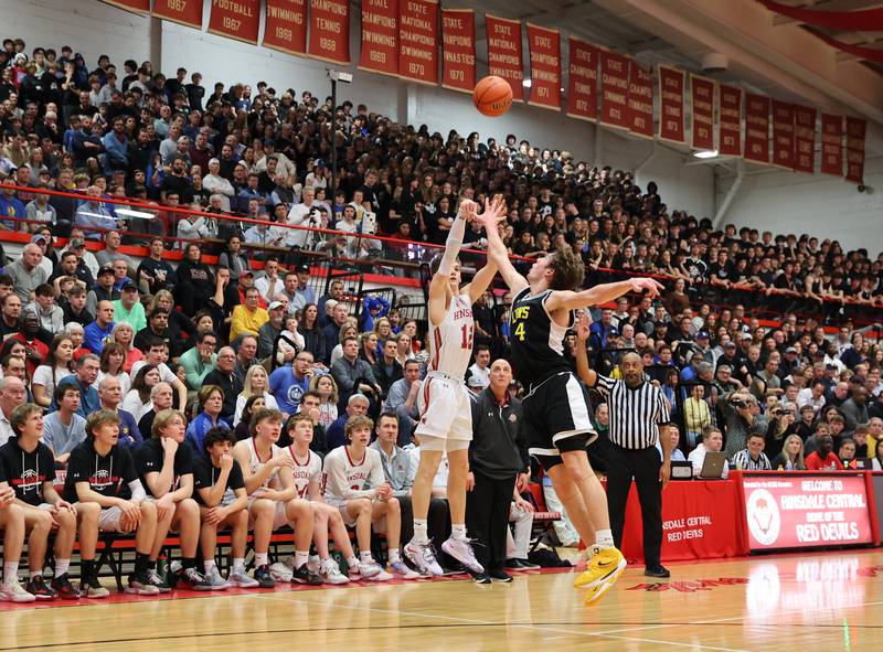 Hinsdale Central's Ben Oosterbaan (12) takes a three-point shot during the boys 4A varsity sectional semi-final game between Hinsdale Central and Lyons Township high schools in Hinsdale on Wednesday, March 1, 2023.