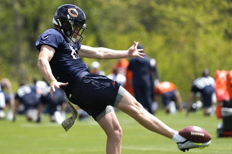 Chicago Bears punter Tory Taylor punts a ball during the NFL football team's rookie camp at Halas Hall in Lake Forest, Ill., Friday, May 10, 2024. (AP Photo/Nam Y. Huh)