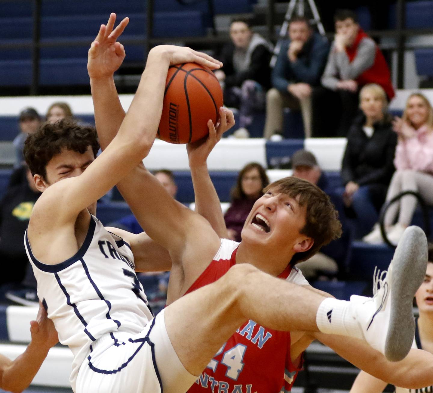 Cary-Grove's Zach Bauer bottles with Marian Central's Christian Bentancur for a rebound during a non-conference basketball game Monday, Dec.19, 2022, at Cary-Grove High School in Cary.