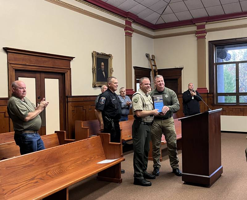 Lee County Deputy Kyle Kellen (left) was presented a life saver award by Sheriff Clay Whelan (right) Thursday evening.