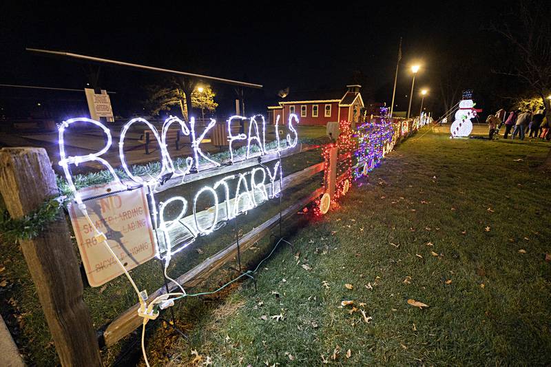 Rock Falls Rotary has their regular spot along the fence at the Little Red School House in Centennial Park.